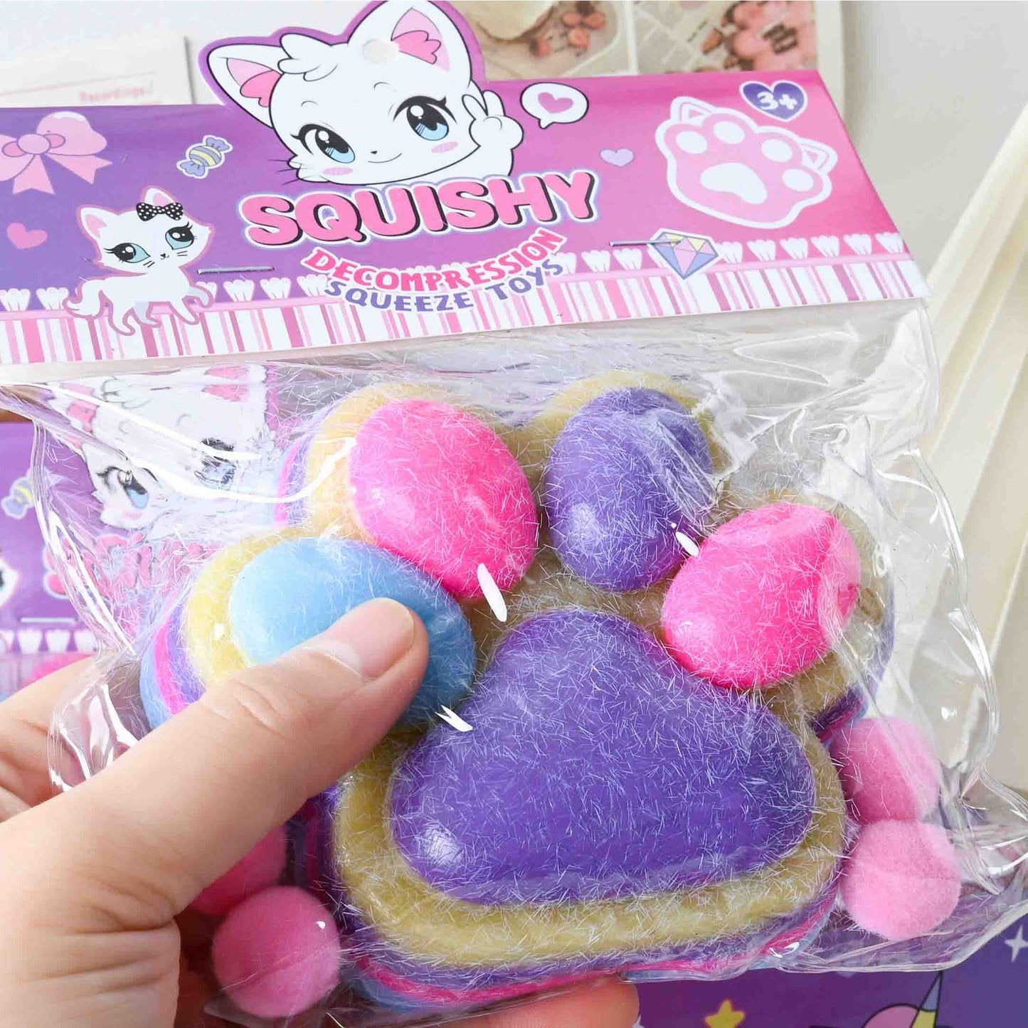 Jucarie Antistres Squishy, selexmo, cu Revenire Lenta, Model Labuta de Pisica Pufoasa, 12.5x10.5 cm, 220g, Squeeze Pinch Family, Ambalaj Transparent, Mov-Multicolor