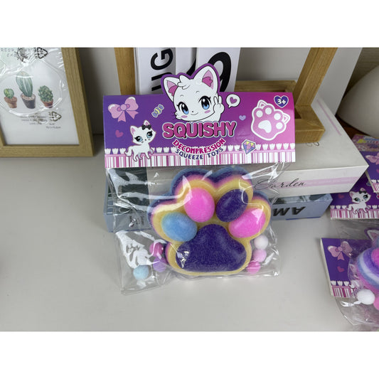 Jucarie Antistres Squishy, selexmo, cu Revenire Lenta, Model Labuta de Pisica Pufoasa, 12.5x10.5 cm, 220g, Squeeze Pinch Family, Ambalaj Transparent, Mov-Multicolor