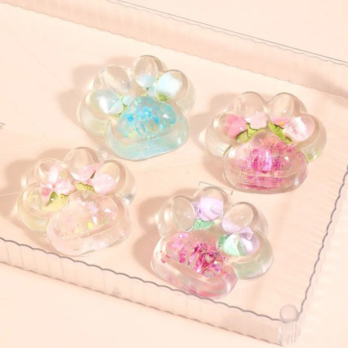 Jucarie Antistres Squishy, selexmo, Labuta de Pisica Pufoasa, cu Revenire Lenta, 7 x 6.5 cm, Model Flori 1, Transparent