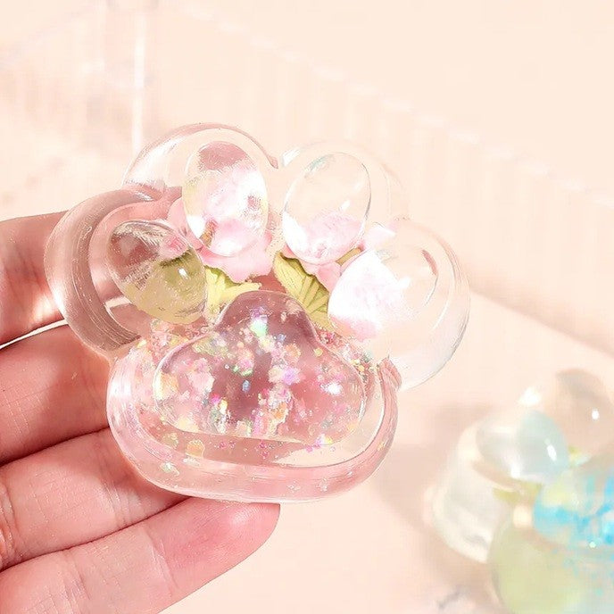Jucarie Antistres Squishy, selexmo, Labuta de Pisica Pufoasa, cu Revenire Lenta, 7 x 6.5 cm, Model Flori 1, Transparent
