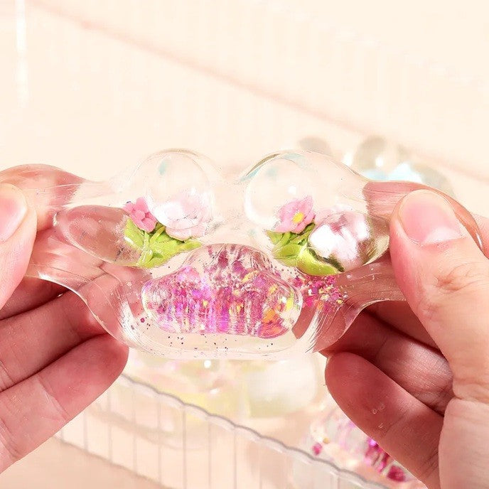 Jucarie Antistres Squishy, selexmo, Labuta de Pisica Pufoasa, cu Revenire Lenta, 7 x 6.5 cm, Model Flori 1, Transparent