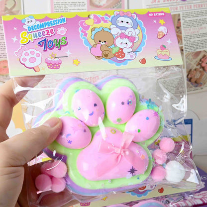 Jucarie Antistres Squishy, selexmo, cu Revenire Lenta, Model Labuta de Pisica YY1005, 220g, 12.5 x 10.5 cm, Squeeze Pinch Family, Ambalaj Transparent, Roz-Curcubeu