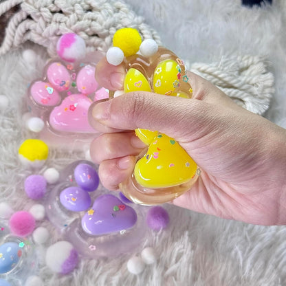Jucarie Antistres Squishy, selexmo, cu Revenire Lenta, Labuta de Pisica Pufoasa, 7.5 cm, Ambalaj Transparent, Model 27059, Multicolor