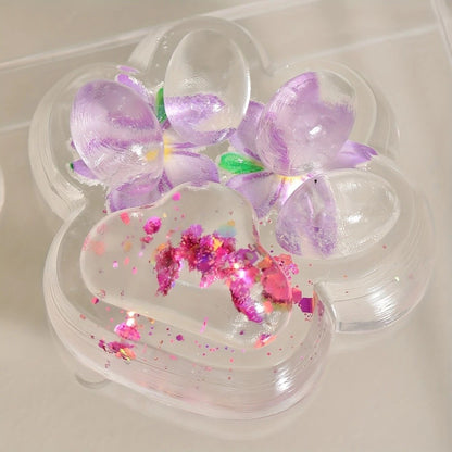 Jucarie Antistres Squishy, selexmo, Labuta de Pisica Pufoasa, cu Revenire Lenta, 7 x 6.5 cm, Model Flori 2, Transparent