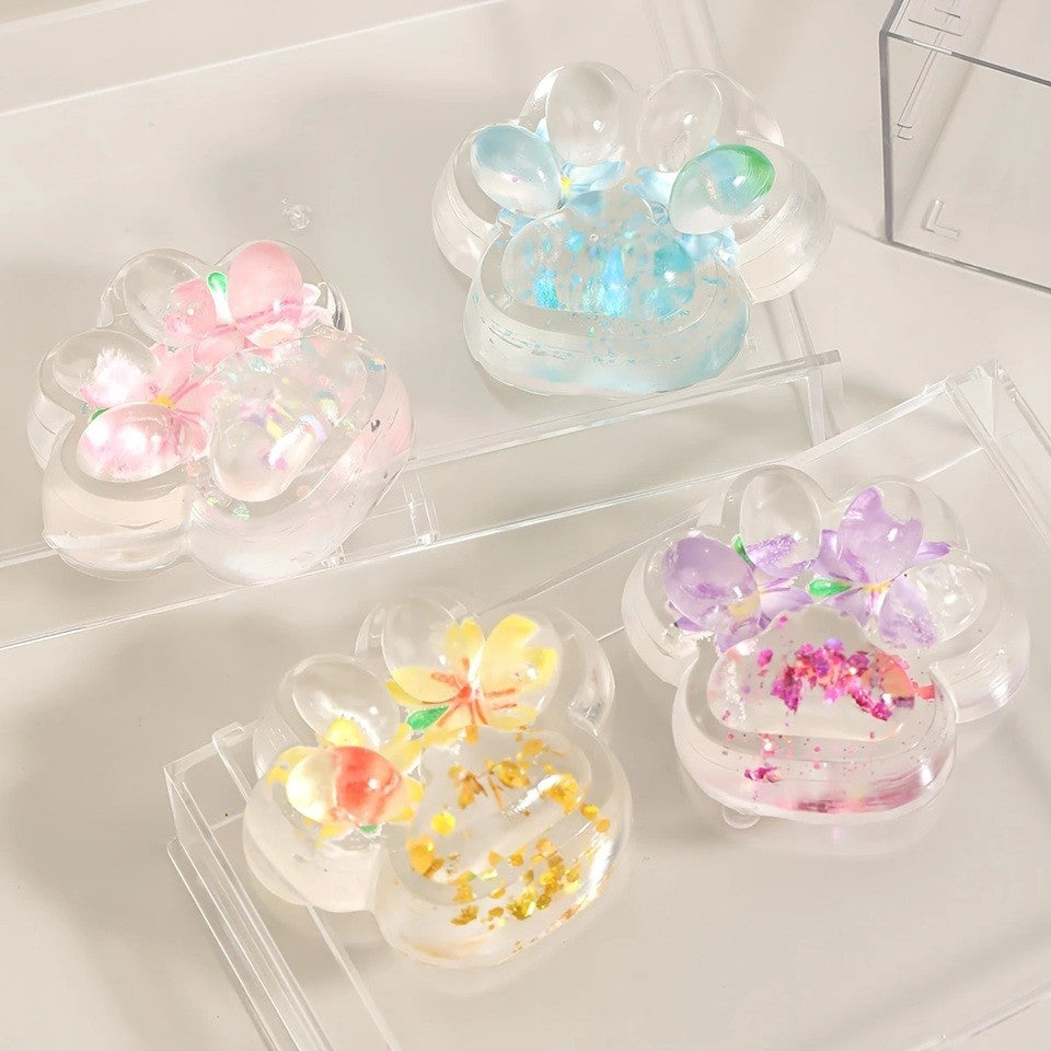 Jucarie Antistres Squishy, selexmo, Labuta de Pisica Pufoasa, cu Revenire Lenta, 7 x 6.5 cm, Model Flori 2, Transparent
