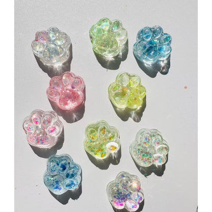 Jucarie Antistres Squishy, selexmo, cu Revenire Lenta, Squeeze Pinch Family, Model Cat Paw, 6.5 x 7 cm, din Tpr, 4-6 Ani, Model 4 Sclipici, Transparent
