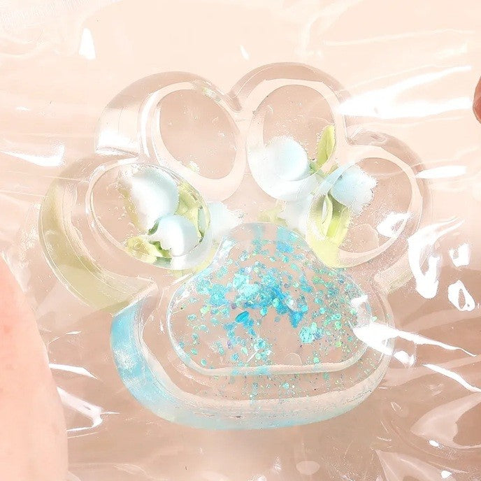 Jucarie Antistres Squishy, selexmo, Labuta de Pisica Pufoasa, cu Revenire Lenta, 7 x 6.5 cm, Model Flori 1, Transparent