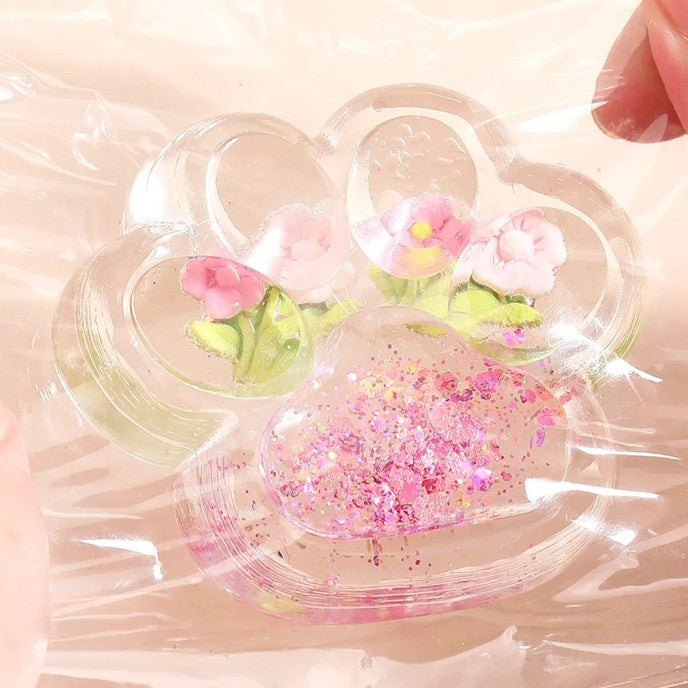 Jucarie Antistres Squishy, selexmo, Labuta de Pisica Pufoasa, cu Revenire Lenta, 7 x 6.5 cm, Model Flori 1, Transparent