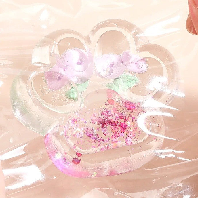 Jucarie Antistres Squishy, selexmo, Labuta de Pisica Pufoasa, cu Revenire Lenta, 7 x 6.5 cm, Model Flori 1, Transparent
